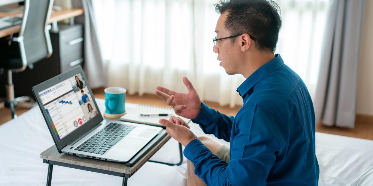 man talking laptop business video chat at home