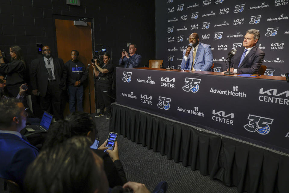 Shaquille O'Neal, left, and Alex Martins, right, CEO of the Orlando Magic, speak during a pre-game press conference about the Orlando Magic retiring his jersey before the Oklahoma City Thunder NBA basketball game, Tuesday, Feb. 13, 2024, in Orlando, Fla. (AP Photo/Kevin Kolczynski)