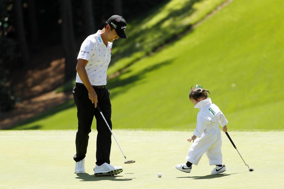 AUGUSTA, GEORGIA - APRIL 10: Kevin Na of the United States stands with daughter Sophia during the Par 3 Contest prior to the Masters at Augusta National Golf Club on April 10, 2019 in Augusta, Georgia. (Photo by Kevin C. Cox/Getty Images)