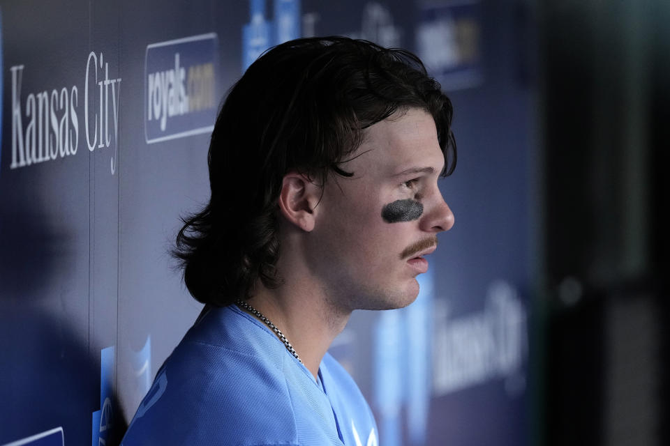 Kansas City Royals' Bobby Witt Jr. watches from the dugout during the seventh inning of a baseball game against the Cleveland Guardians Wednesday, Sept. 20, 2023, in Kansas City, Mo. (AP Photo/Charlie Riedel)