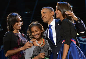 US President Barack Obama accompanied by (from L-R ) First Lady Michelle and daughters Sasha and Malia | Photo Credits: Jewel Samad/AFP/Getty Images