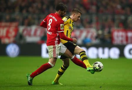 Soccer Football - Bayern Munich v Borussia Dortmund - DFB Pokal Semi Final - Allianz Arena, Munich, Germany - 26/4/17 Bayern Munich's Javi Martinez in action with Borussia Dortmund's Erik Durm Reuters / Michael Dalder Livepic