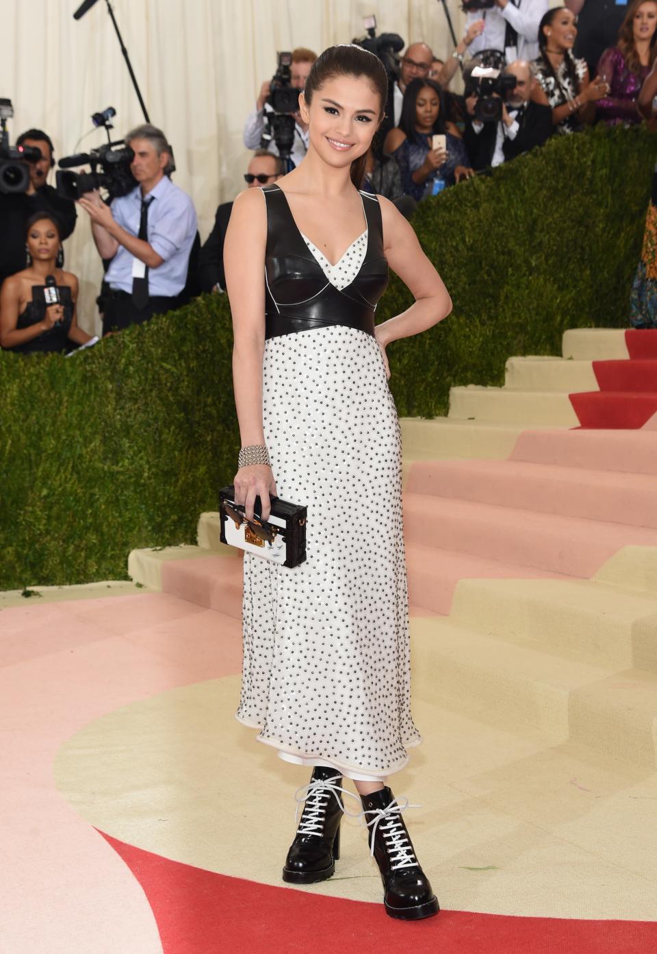 <p>Selena wore her edgiest look yet to the 2016 Met Gala, layering a sleek bra over a printed Louis Vuitton dress and finishing the look with lace-up combat boots. She clearly <em>nailed</em> the night's futuristic theme.</p>