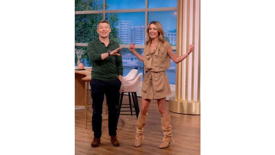 Cat Deeley in a mini dress and boots next to ben shephard