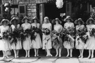 <p>Although '20s bridal style veered towards the modern silhouette (a.k.a. the drop waist dress), many brides still opted for tradition and dressed their bridesmaids in all white. </p>