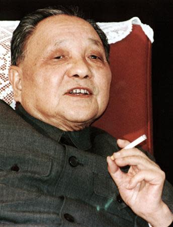 China's leader Deng Xiaoping smokes one of his favourite Panda brand cigarettes in this 1986 file photo taken in Beijing. REUTERS/Stringer/Files