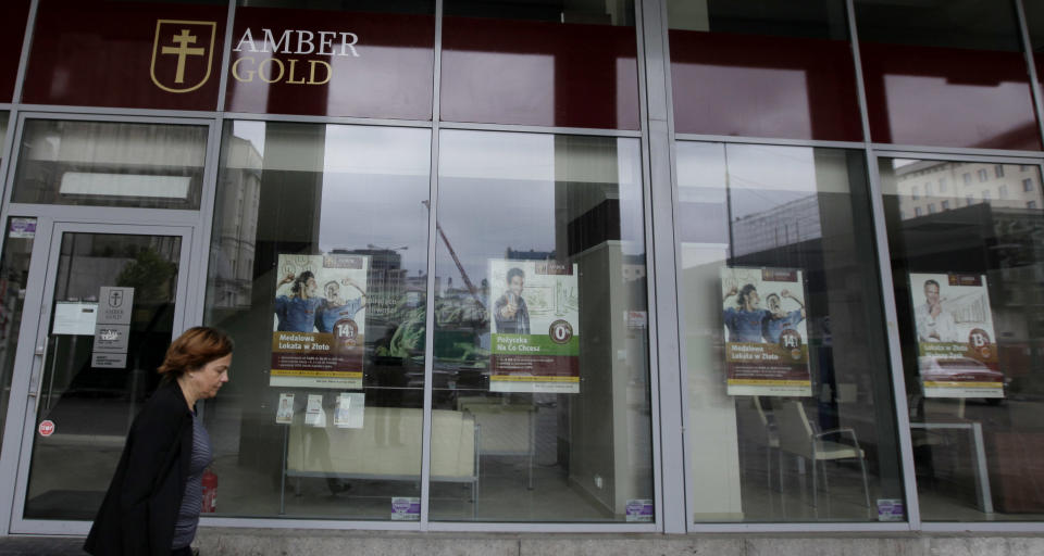 The photograph shows an outlet of the financial institute Amber Gold in Warsaw, Poland, Monday, Aug. 27, 2012, after the organization was liquidated and has emerged as an unsustainable pyramid scheme. Amber Gold promised guaranteed returns of between 10 to 14 percent annually for what it claimed were investments in gold and for many of its clients who grew up under communism the prospects of high returns on investments was too much to resist. Now officials say it operated like a pyramid scheme, and thousands of its clients are facing the prospect of never seeing their money again. (AP Photo/Czarek Sokolowski)