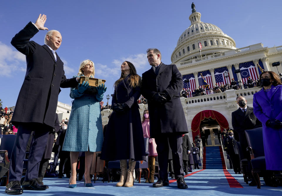 FILE - Joe Biden is sworn in as the 46th president of the United States by Chief Justice John Roberts as Jill Biden holds the Bible during the 59th Presidential Inauguration at the U.S. Capitol in Washington, on Jan. 20, 2021, as their children Ashley and Hunter watch. (AP Photo/Andrew Harnik, Pool, File)