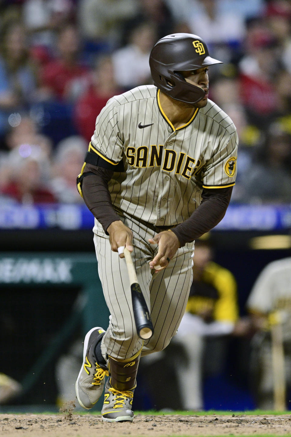 San Diego Padres' Trent Grisham watches the ball after hitting a RBI double to score Robinson Cano off Philadelphia Phillies' Brad Hand during the seventh inning of a baseball game, Tuesday, May 17, 2022, in Philadelphia. (AP Photo/Derik Hamilton)