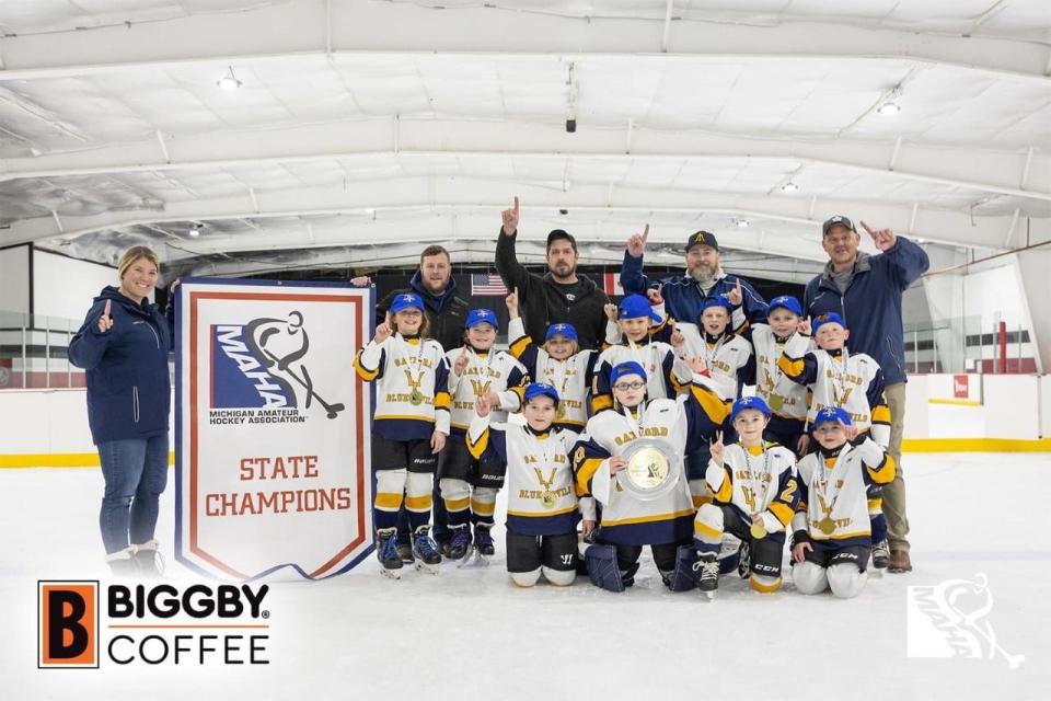 The Gaylord Jr. Blue Devils 8U hockey team celebrates after winning the MAHA State Championship on Sunday, March 5.