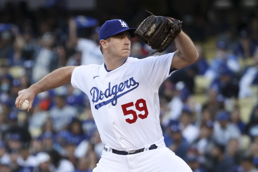 Los Angeles, CA - October 21: Los Angeles Dodgers pitcher Evan Phillips delivers a pitch.