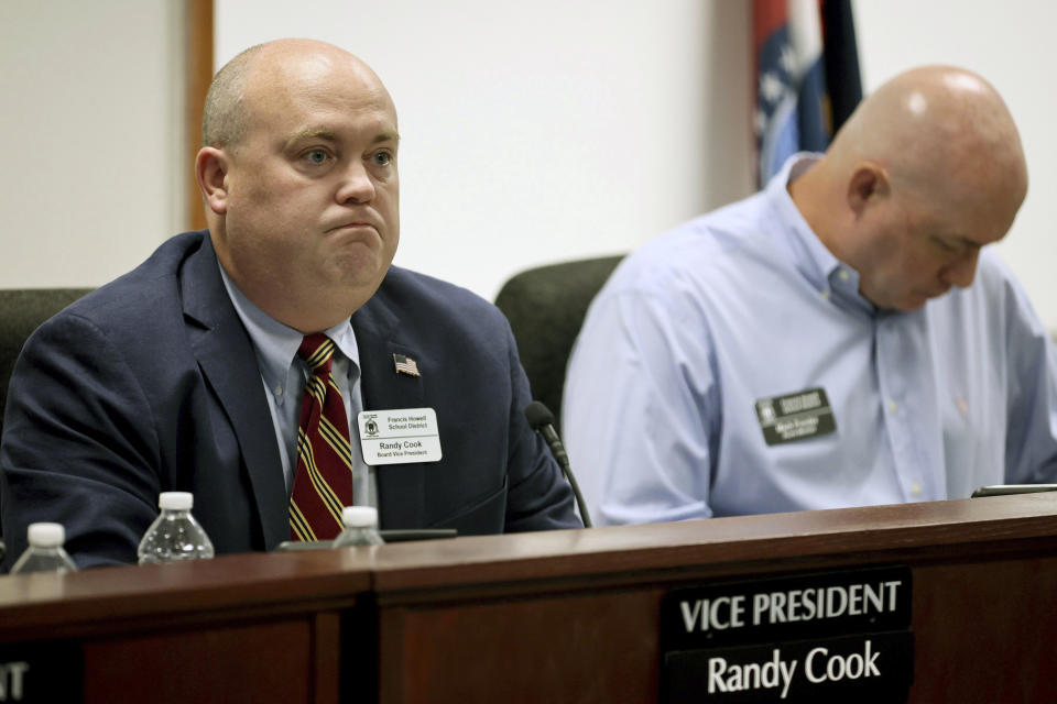 FILE - Francis Howell School Board member Randy Cook, left, listens during the public comment portion of the school board meeting Thursday, July 20, 2023 in O'Fallon, Mo. At right is school board member Mark Ponder. The Francis Howell School Board on Thursday, Dec. 21, voted to drop elective Black history and literature courses at the district's high schools. (David Carson/St. Louis Post-Dispatch via AP)