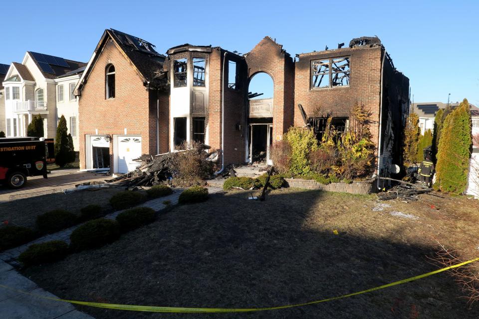 The investigation of a fatal fire at 5 Harvest Way in Little Egg Harbor continues Tuesday, March 7, 2023, the day after the fire destroyed that home and damaged two adjacent ones.  