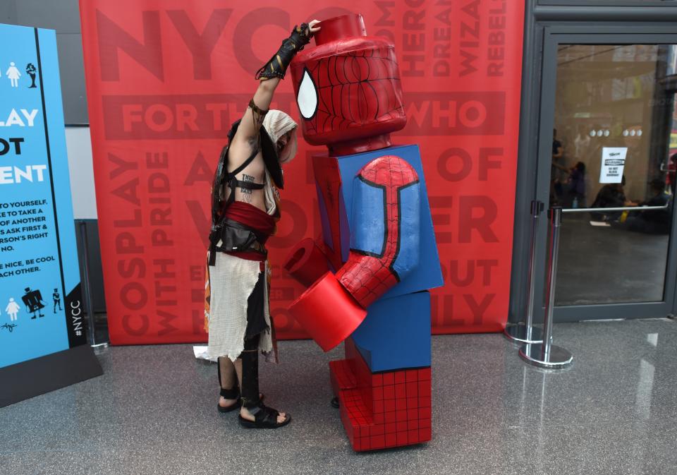 Bayek from "Assassin's Creed: Origins" and Giant Lego Spider-Man.