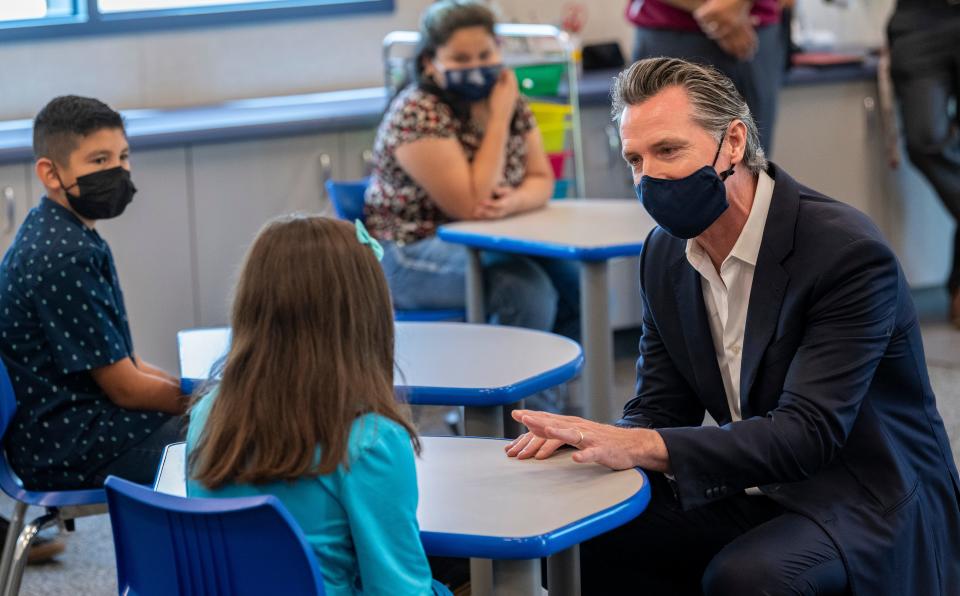 California Gov. Gavin Newsom visits with Traver Joint Elementary School students in Tulare County on  July 20. He and officials from other counties discussed the state's plan to achieve equitable statewide access to high-speed broadband internet service. He signed a bill that includes $6 billion toward broadband expansion throughout California.