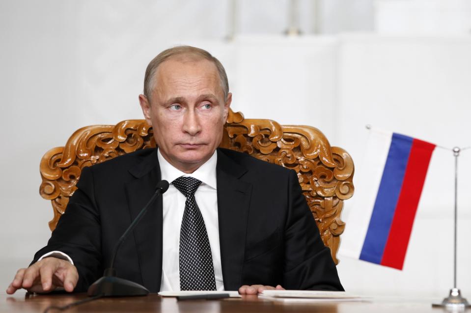 Russian President Vladimir Putin attends a signing ceremony with his Mongolian counterpart Tsakhia Elbegdorj (not pictured) at the national parliament building in Ulan Bator, September 3, 2014. REUTERS/B.Rentsendorj (MONGOLIA - Tags: POLITICS)