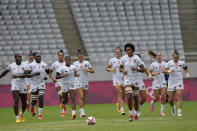 United States players jog out onto the pitch at the start of their women's rugby sevens 5-8 placing match against China at the 2020 Summer Olympics, Saturday, July 31, 2021 in Tokyo, Japan. (AP Photo/Shuji Kajiyama)