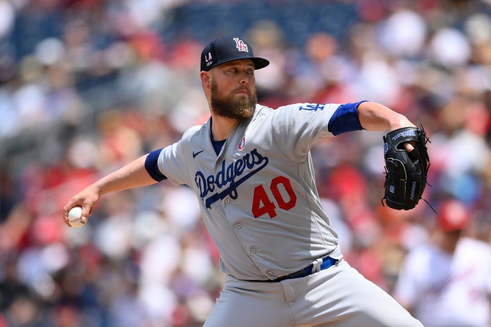 FILE - Los Angeles Dodgers starting pitcher Jimmy Nelson delivers a pitch during a baseball game against the Washington Nationals on July 4, 2021, in Washington. Nelson finalized a $1.2 million contract on Thursday, Feb. 16, 2023, with the Los Angeles Dodgers. (AP Photo/Nick Wass, File)