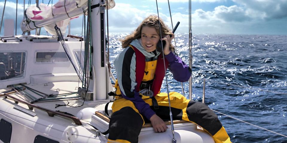 jessica watson makes a call from a boat in a scene from true spirit, a good housekeeping pick for best kids movies 2023