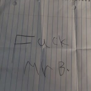 Close-up of handwritten "Fuck Mr B"