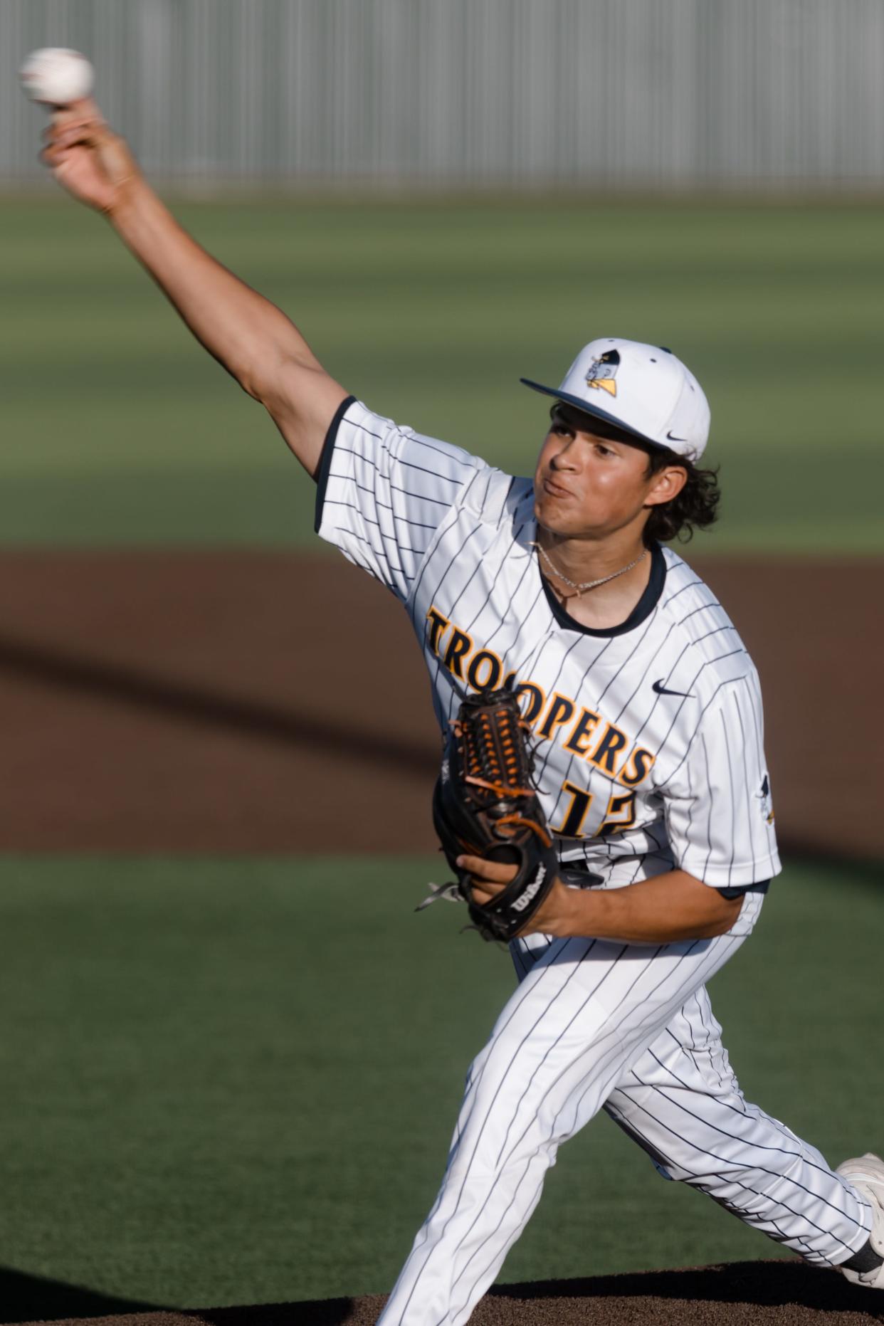 Eastwood's Isaac Herrera (12) pitches at a baseball game against Pebble Hills on Friday, March 18, 2022, at Eastwood High School, in El Paso, Texas.