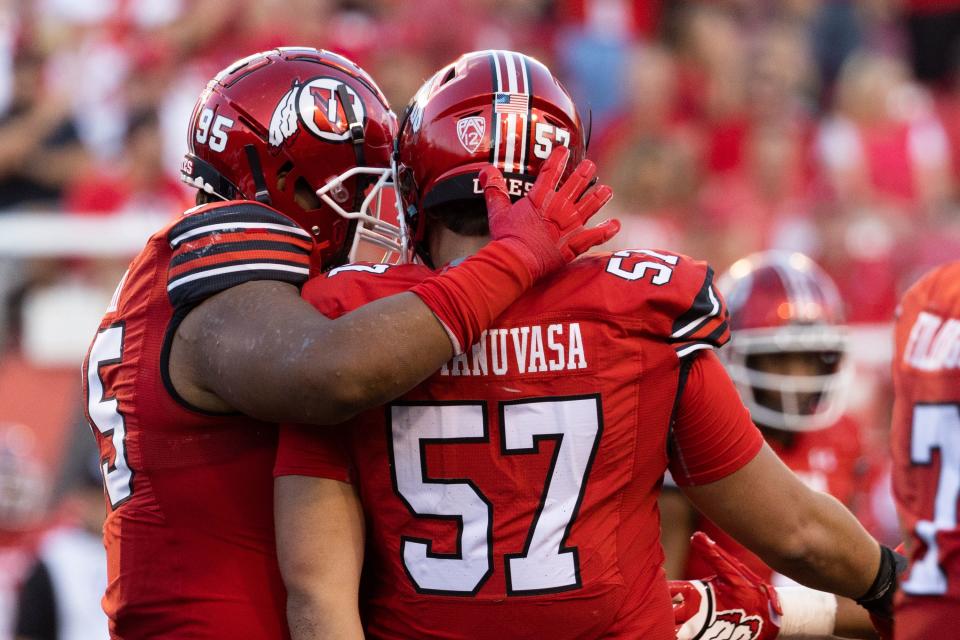 Utah Utes defensive tackle Aliki Vimahi (95) celebrates with Utah Utes defensive tackle Keanu Tanuvasa (57) on a quarterback sack during the season opener against Florida at Rice-Eccles Stadium in Salt Lake City on Thursday, Aug. 31, 2023. | Megan Nielsen, Deseret News