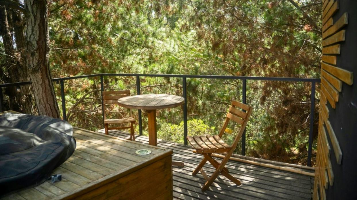 Balcony of private home rental in wooded area