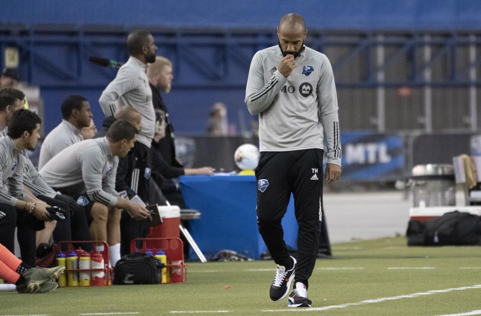 FILE - Montreal Impact coach Thierry Henry paces the sideline during the second half in the first leg against Olimpia in a CONCACAF Championship League soccer quarterfinal match in Montreal, in this Tuesday, March 10, 2020, file photo. Thierry Henry has resigned as coach of Montreal in Major League Soccer after one season on Thursday, Feb. 25, 2021, citing family reasons. (Paul Chiasson/The Canadian Press via AP, File)