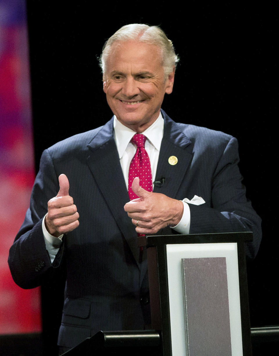 FILE - In this Wednesday, June 20, 2018 file photo, South Carolina Gov. Henry McMaster gives two thumbs up during the gubernatorial debate at Newberry Opera House in Newberry, S.C. With less than three weeks until Election Day, South Carolina voters are getting a chance to see a matchup between the two candidates vying to be their next governor. Gov. Henry McMaster and his Democratic challenger, state Rep. James Smith, meet for a debate on Wednesday, Oct. 17, 2018 at the Francis Marion University Performing Arts Center in Florence. (Andrew Whitaker/The Post And Courier via AP, File)