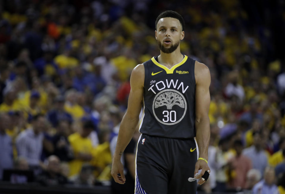 Golden State Warriors' Stephen Curry walks on the court during a timeout in the second quarter of Game 6 of basketball's NBA Finals against the Toronto Raptors Thursday, June 13, 2019, in Oakland, Calif. (AP Photo/Ben Margot)