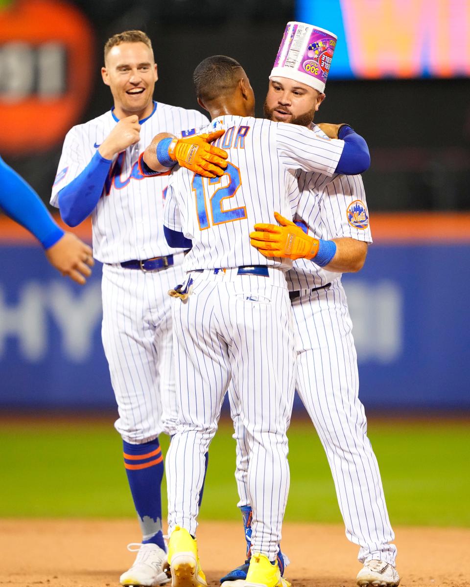 Aug 30, 2023; New York City, New York, USA;  New York Mets shortstop Francisco Lindor (12) embraces right fielder DJ Steward (29) for winning the game against the Texas Rangers along with center fielder Brandon Nimmo (9) at Citi Field. Mandatory Credit: Gregory Fisher-USA TODAY Sports