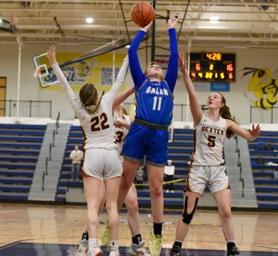 Salem's Abby Resovsky scores down low during the Division 1 girls basketball regional final Thursday, March 9, 2023, at Saline.