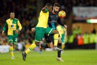 Norwich's Sebastien Bassong and Arsenal's Olivier Giroud in action Action Images via Reuters / Andrew Boyers