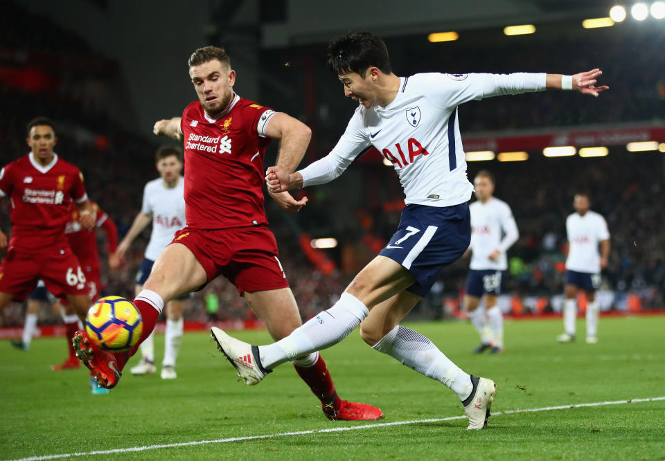 Jordan Henderson and Heung-min Son during the Premier League match between Liverpool and Tottenham Hotspur at Anfield on February 4, 2018 in Liverpool, England.