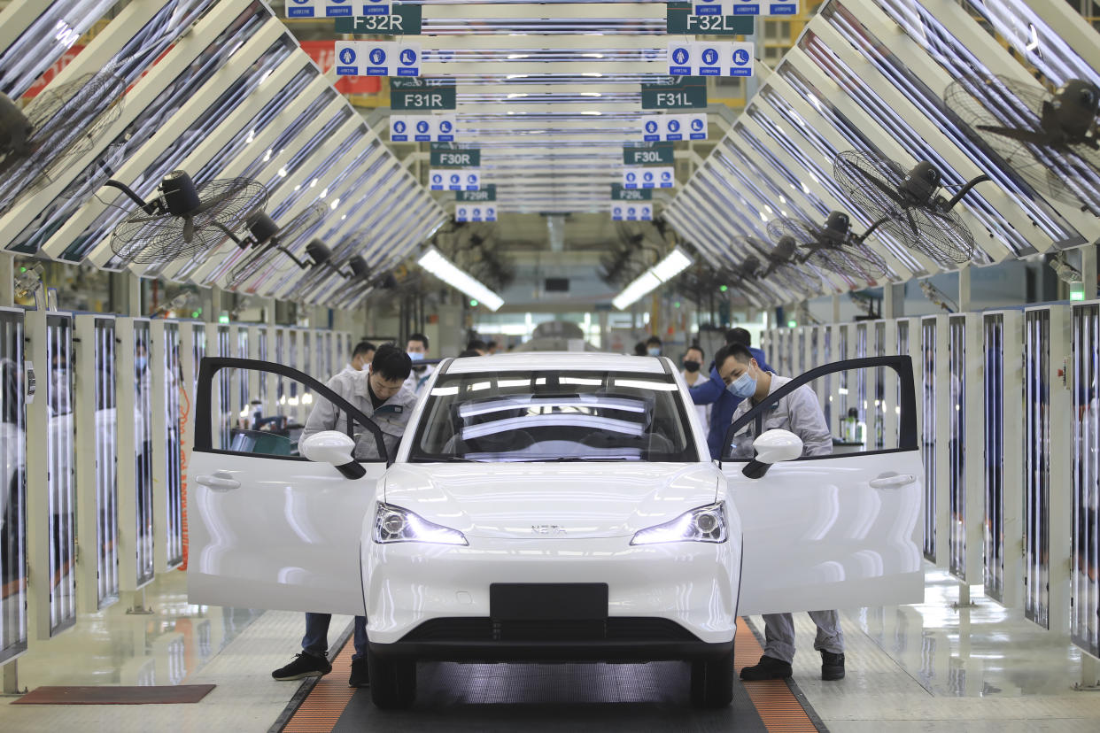 JIAXING, CHINA - FEBRUARY 19: Employees work on the assembly line of Neta electric car at a factory of Hozon New Energy Automobile Co., Ltd on February 19, 2021 in Jiaxing, Zhejiang Province of China. (Photo by Cheng Jie/VCG via Getty Images)