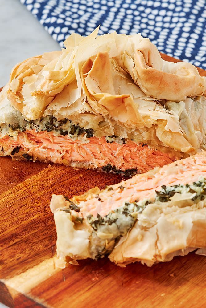 <p>A whole salmon en croûte is a fantastic <a href="https://www.delish.com/uk/easy-dinner-ideas/" rel="nofollow noopener" target="_blank" data-ylk="slk:dinner;elm:context_link;itc:0" class="link ">dinner</a> party centrepiece, but often the lashings of full-fat cream cheese and all-butter puff <a href="https://www.delish.com/uk/cooking/recipes/a30268442/vegan-sausage-rolls/" rel="nofollow noopener" target="_blank" data-ylk="slk:pastry;elm:context_link;itc:0" class="link ">pastry</a> puts people off if they're looking for a <a href="https://www.delish.com/uk/cooking/recipes/g29871554/healthy-dinner-recipes/" rel="nofollow noopener" target="_blank" data-ylk="slk:healthier;elm:context_link;itc:0" class="link ">healthier</a> meal to make. This is where our healthy salmon en croûte comes in.</p><p>Get the <a href="https://www.delish.com/uk/cooking/recipes/a30271263/salmon-en-croute/" rel="nofollow noopener" target="_blank" data-ylk="slk:Salmon En Croûte;elm:context_link;itc:0" class="link ">Salmon En Croûte</a> recipe.</p>