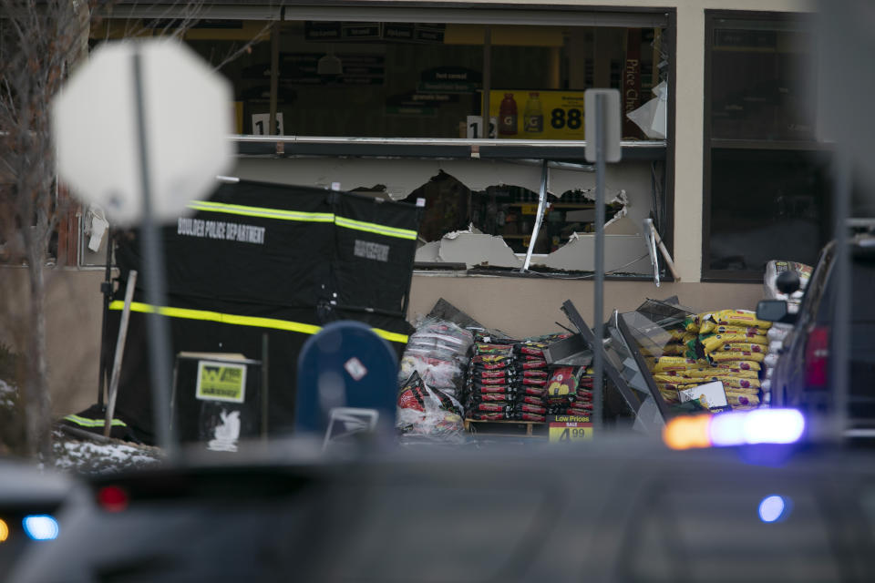 Damaged windows appear at a King Soopers grocery store where a shooting took place Monday, March 22, 2021, in Boulder, Colo. (AP Photo/Joe Mahoney)
