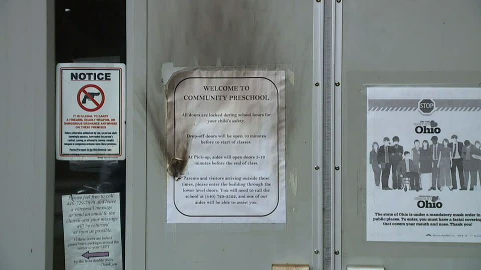 Burn marks are seen on the door of the Community Church of Chesterland (CCC), in Chesterland, Ohio. - WEWS