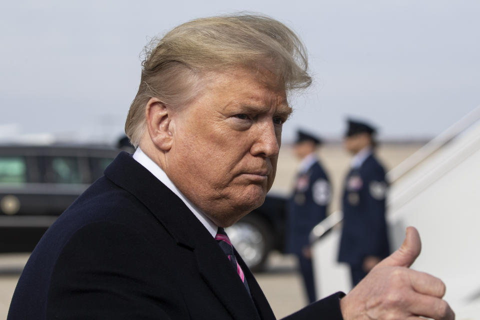 President Donald Trump gives thumbs up after speaking with the media as he boards Air Force One as he departs Tuesday, Feb. 18, 2020, at Andrews Air Force Base, Md.(AP Photo/Alex Brandon)