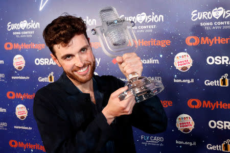 Duncan Laurence of the Netherlands, the winner of the 2019 Eurovision Song Contest, holds up the trophy during a news conference in Tel Aviv, Israel May 19, 2019. REUTERS/Ronen Zvulun