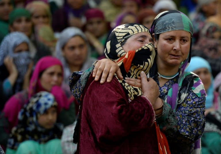 Thousands of mourners defied the security curbs Sunday to attended the burial of the rebel commander in his hometown amid anti-India and pro-Independence slogans