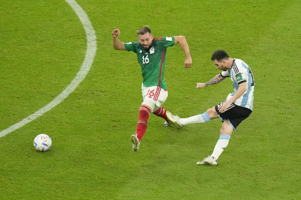 Argentina's Lionel Messi shoots and scores a goal