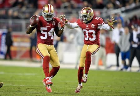 Sep 12, 2016; Santa Clara, CA, USA; San Francisco 49ers outside linebacker Ray-Ray Armstrong (54) celebrates intercepting a pass against the Los Angeles Rams with 49ers cornerback Rashard Robinson (33) during the second half of an NFL game at Levi's Stadium. Mandatory Credit: Kirby Lee-USA TODAY Sports