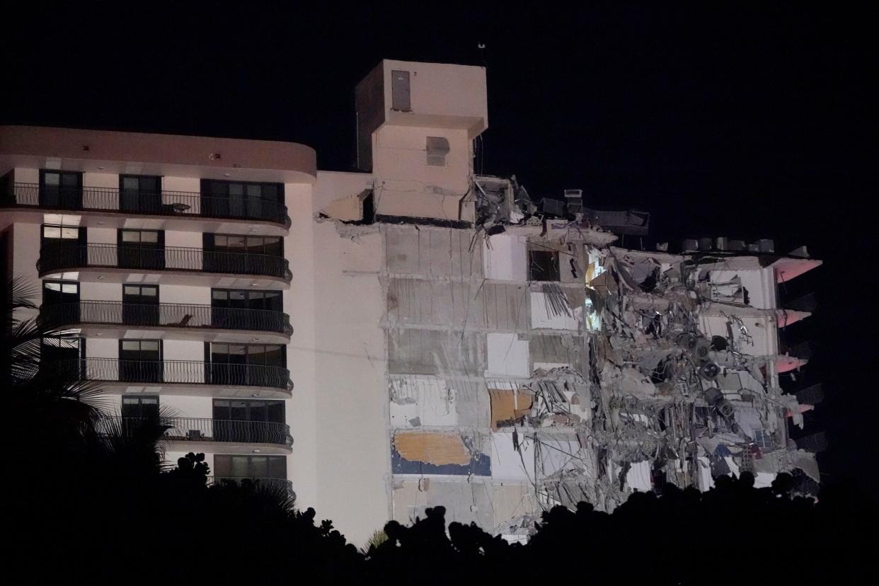 A partially collapsed building is seen early Thursday, June 24, 2021, in the Surfside area of Miami, Fla.