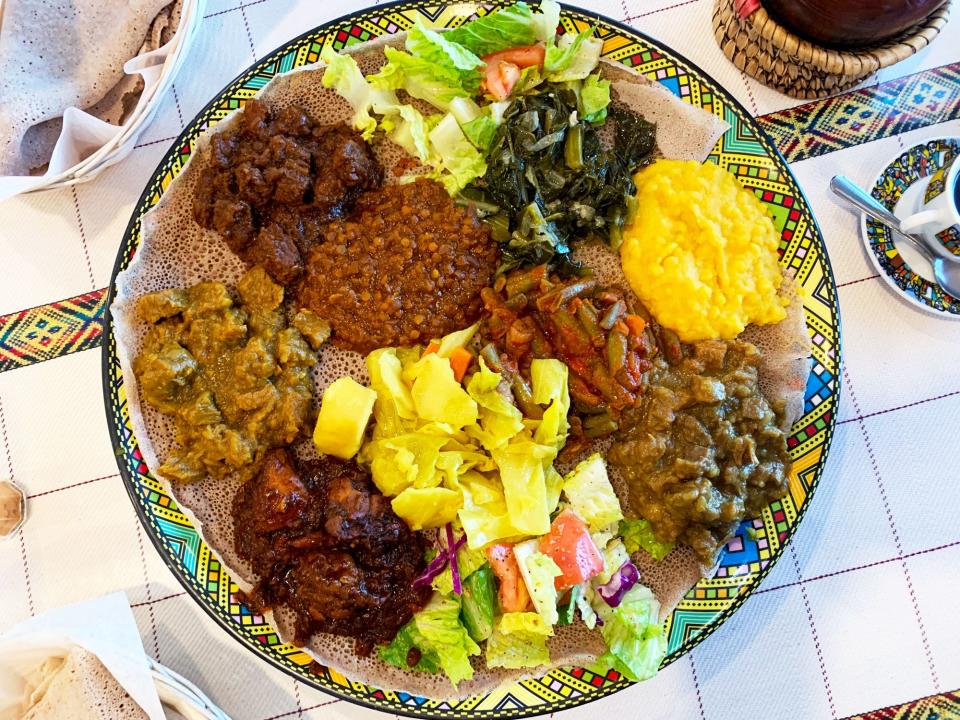 The Lalibela Deluxe combo plate at Cafe Lalibela features multiple varieties of alicha, gomen collard greens and fossolia green beans.