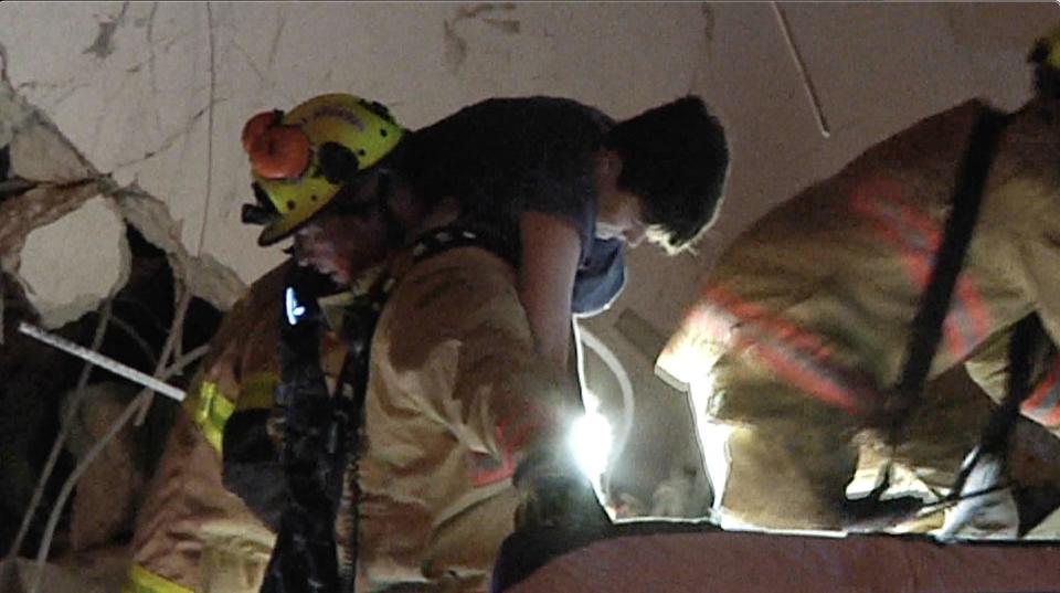 Firefighters extracted Jonah after more than an hour inside the pile. Footage of the rescue was broadcast on news shows around the world. - Credit: Reliable News Media
