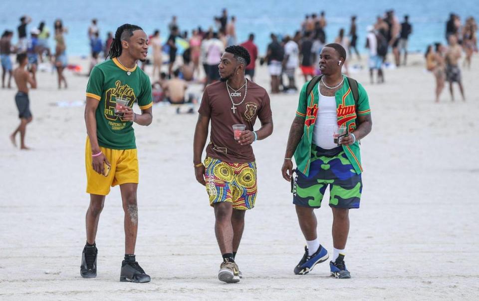 Alabama State University spring breakers Jacory Lee, 21, Justin Stephens, 22, and Terry Haynes, 22, walk on South Beach on Thursday, March 17, 2022.