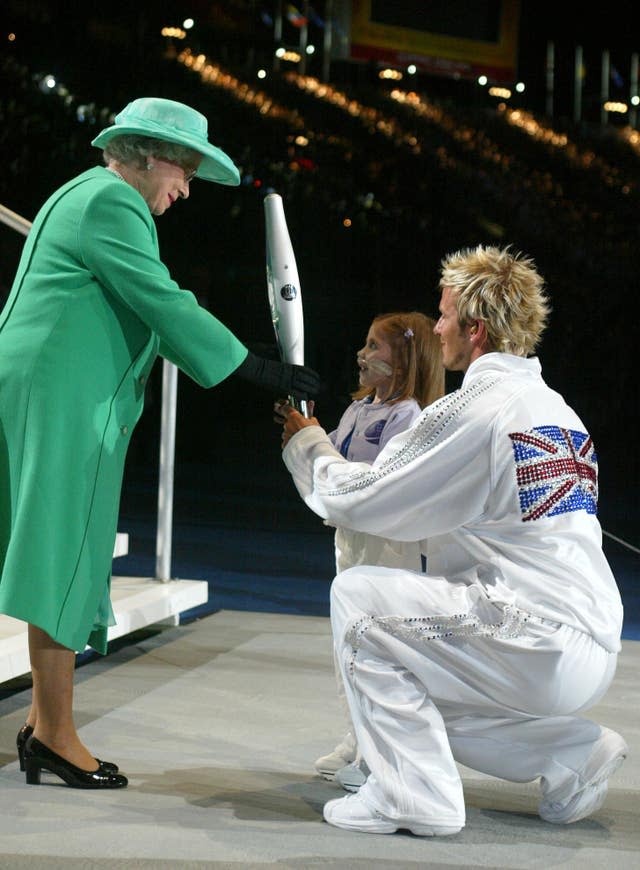 At the opening of the 2002 Commonwealth Games, England captain David Beckham and Kirsty Howard handed the Queens Jubille baton to Queen