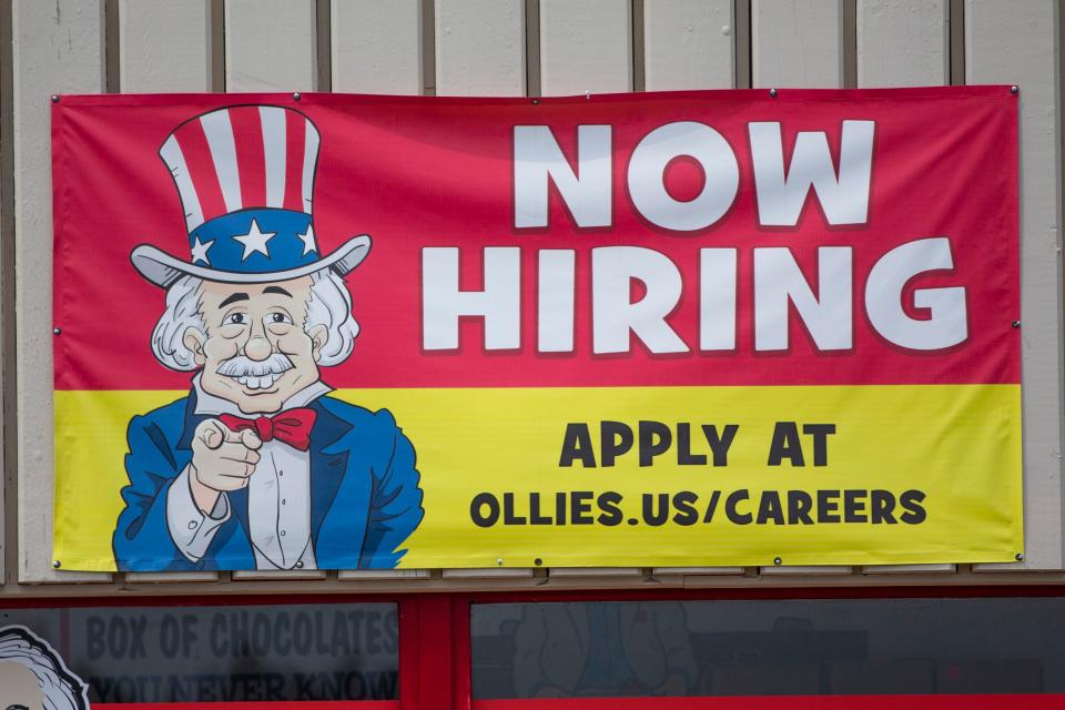 A hiring sign hangs Monday, June 13, 2022, at Ollie's Outlet in Mishawaka.