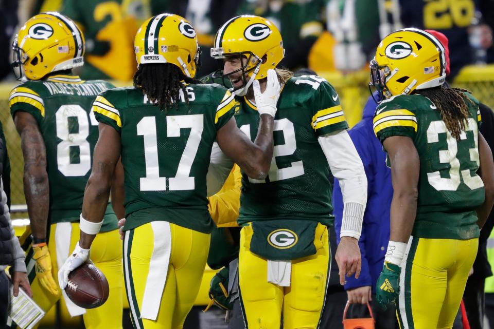 Packers wide receiver Davante Adams (17) celebrates his touchdown reception with quarterback Aaron Rodgers.